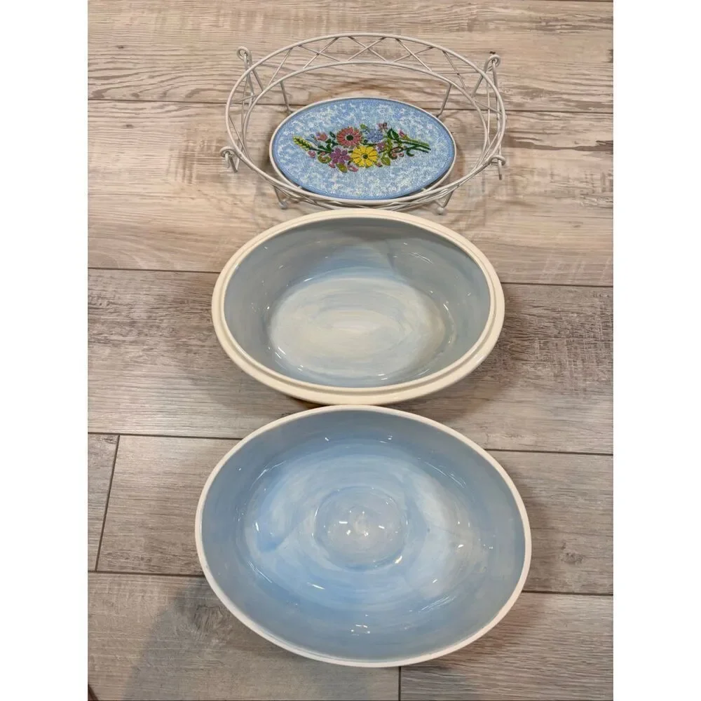 Temp-tations Ovenware by Tara Blue oval covered casserole dish with a metal stan